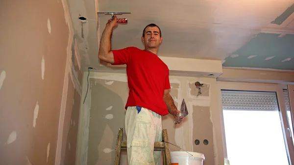 Worker Spreading Plaster with Trowel to Gypsum Board — Stock Photo, Image