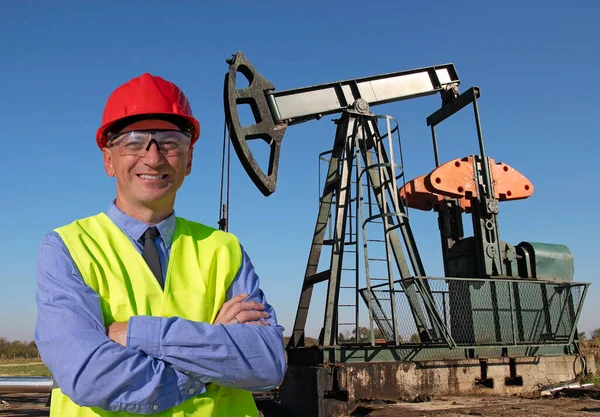 Smiling Engineer Red Hardhat Yellow West Standing Front Oil Well — Stock Photo, Image