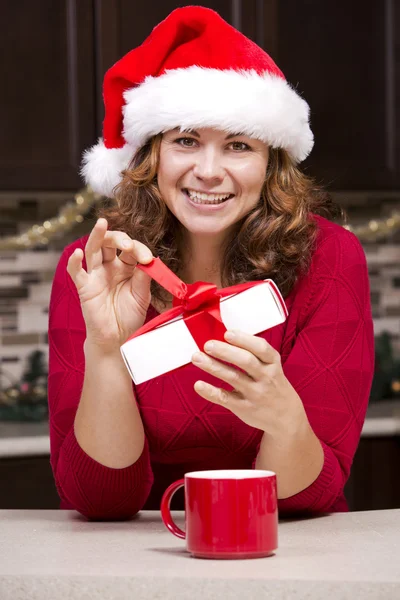 Woman holding Christmas present — Stock Photo, Image
