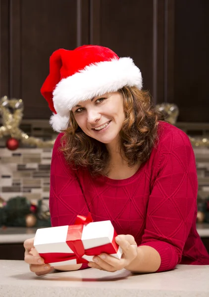 Woman holding Christmas present — Stock Photo, Image