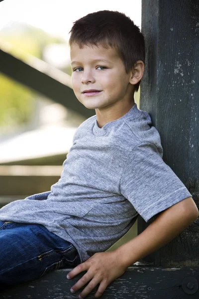 Portrait of a little boy in the park — Stock Photo, Image
