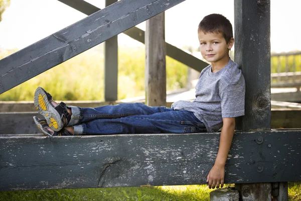 Portrait of a little boy in the park — Stock Photo, Image