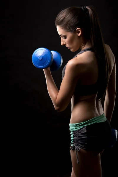 Fitness woman on black background — Stock Photo, Image