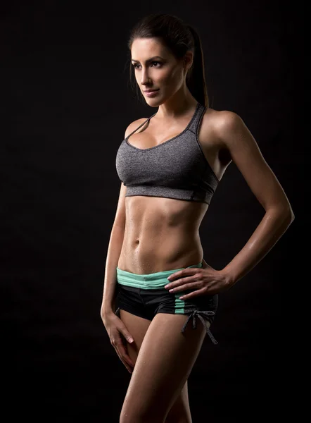 Fitness woman on black background — Stock Photo, Image