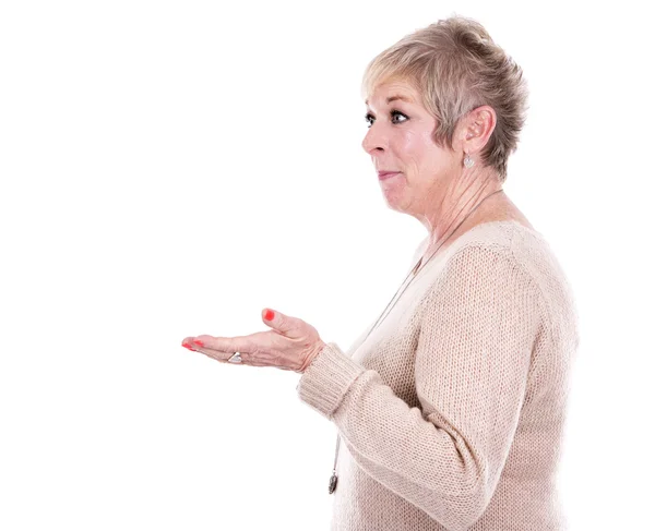 Casual mature woman pointing — Stock Photo, Image