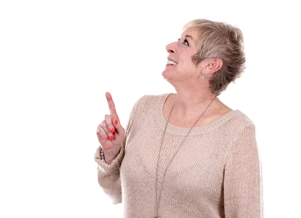 Casual mature woman pointing — Stock Photo, Image