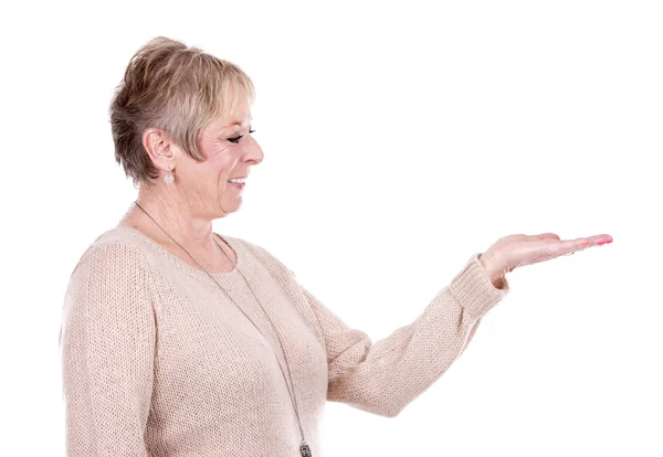 Casual mature woman pointing — Stock Photo, Image