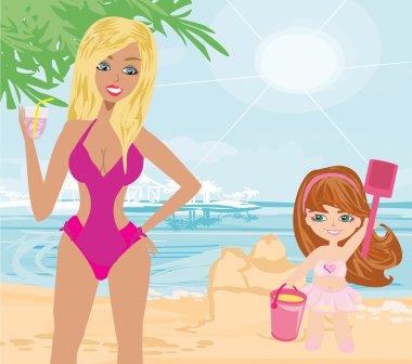 Anne ve kızı sahilde.