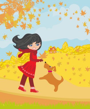 sonbaharda köpeğiyle oynayan kız