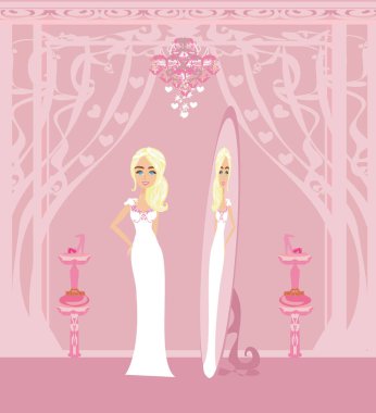 Zarif bir mağazada gelinlik içinde güzel bir kız.