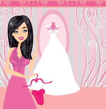 Zarif bir butikte, bir mankenin üzerinde güzel bir elbise.