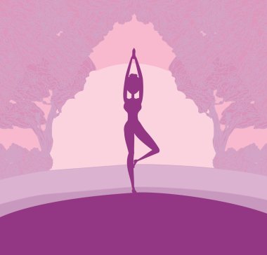 Silhouette woman practicing yoga in the nature 