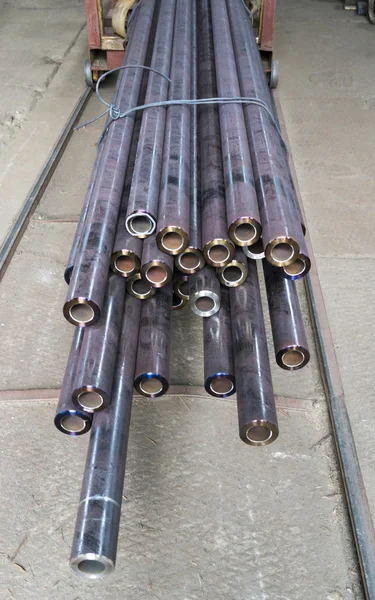 Steel pipes in factory warehouse — Stock Photo, Image