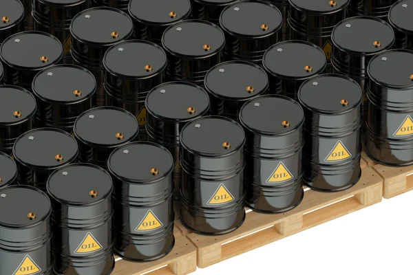 Black oil barrels on pallets — Stock Photo, Image