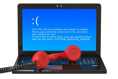Laptop with blue error screen and handset