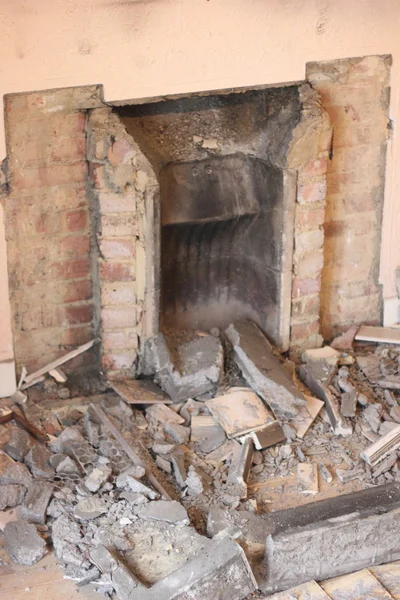 An old fireplace being removed
