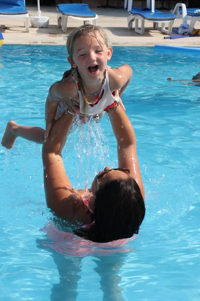 Having fun in a swimming pool — Stock Photo, Image