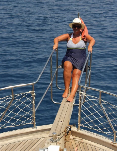 An english lady relaxing while on a boat trip — Stock Photo, Image