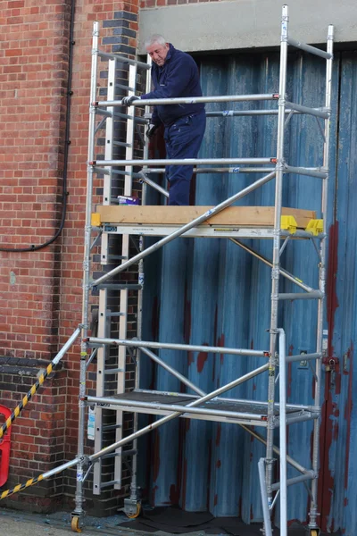 Working from a scaffold tower — Stock Photo, Image