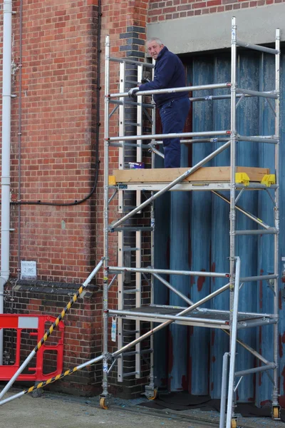 Working from a scaffold tower — Stock Photo, Image