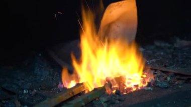 The process of working in a forge