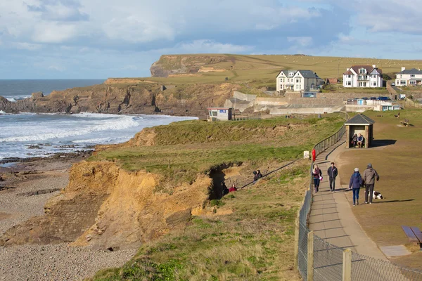 People walking on the path from Bude North Cornwall to nearby beach of Crooklets England UK in spring — Stock Photo, Image
