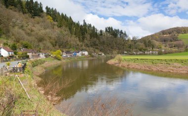 River Wye near Tintern Abbey in the Wye Valley between Monmouthshire Wales and Gloucestershire England  clipart