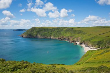Yacht in Lantic Bay Cornish coast Cornwall England