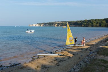 Windsurfing Studland beach Dorset south England UK in summer clipart