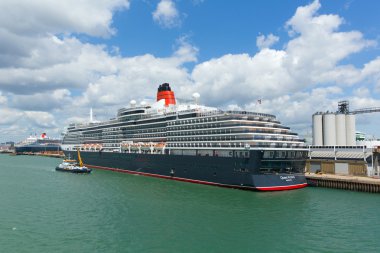 Queen Victoria cruise ship at Southampton Docks England UK in summer on calm day with blue sky clipart