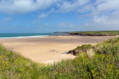 North Cornwall sandy beach Harlyn Bay England UK near Padstow and Newquay and on the South West Coast Path in spring with blue sky and sea clipart
