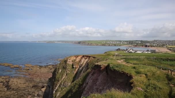 South west coast path towards Thurlestone South Devon England UK from the direction of Hope Cove PAN — Stock Video