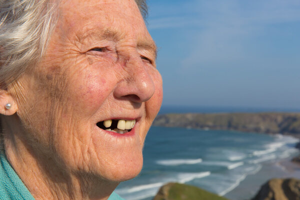 Elderly lady pensioner with dental problems and a tooth missing