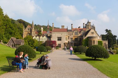 People visiting Tyntesfield House near Bristol Somerset England UK a tourist attraction featuring beautiful flower gardens and a Victorian Gothic Revival house and estate gardens clipart