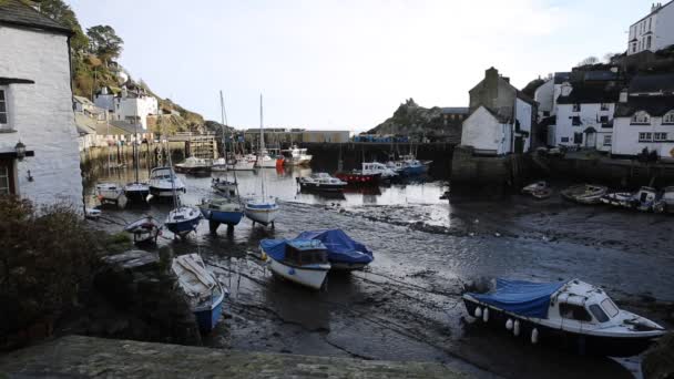 English harbour Polperro Cornwall South West England UK out of season in winter with boats at low tide — Stock Video
