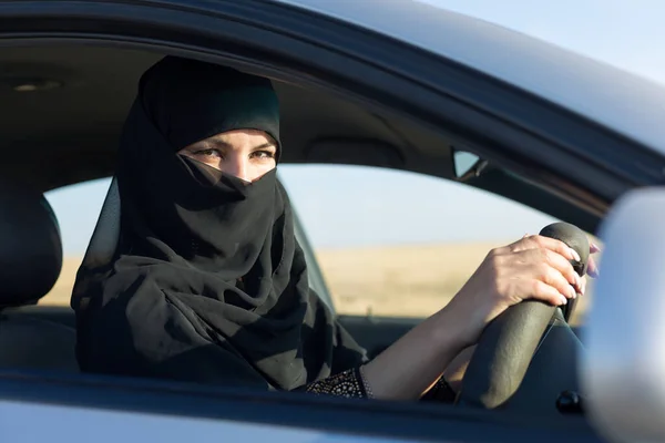 Muslim woman travel by car Traditional clothing.