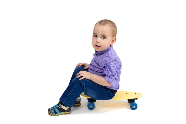 Three Year Old Boy Jeans Sits Skateboard Isolated — Stock Photo, Image