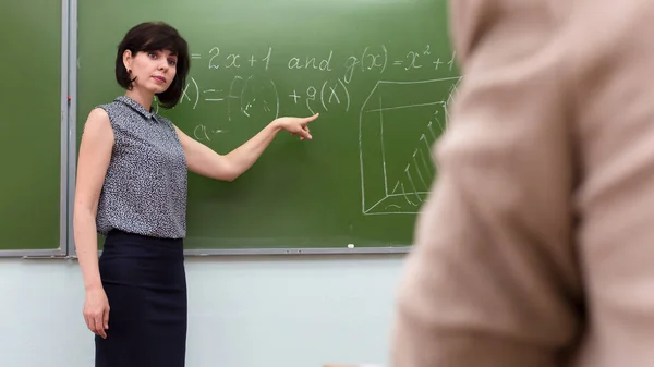 Teacher Stands Blackboard Asks Student Answer Hand Gesture — Stock Photo, Image