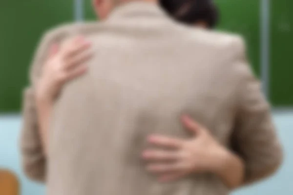 Man Woman Embrace School Classroom Blackboard Blurred Focus — Stock Photo, Image