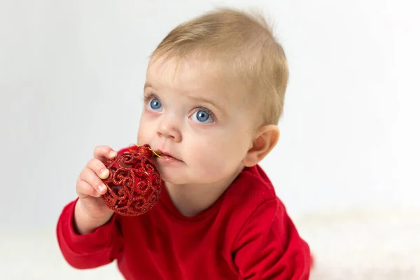 Small Child Red Suit White Background Christmas Toy His Teeth — Stock Photo, Image