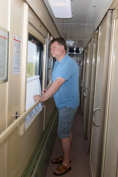 Blond Man Years Old Standing Corridor Train Looks Out Window — Stock Photo, Image