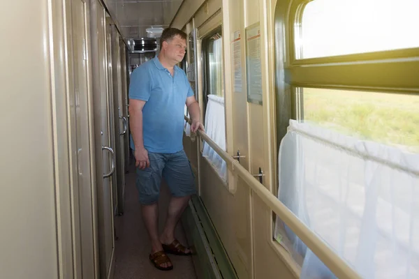 Blond Man Years Old Standing Corridor Train Looks Out Window — Stock Photo, Image