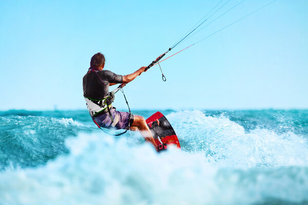 Kiteboarding, Kitesurfing. Water Sports. Kitesurf Action On Wave