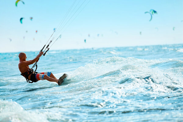 Kiteboarding, Kitesurfing. Water Sports. Kitesurf Action On Wave