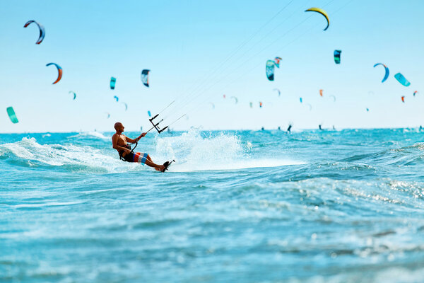 Kiteboarding, Kitesurfing. Water Sports. Kitesurf Action On Wave