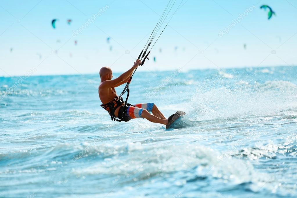 Kiteboarding, Kitesurfing. Water Sports. Kitesurf Action On Wave