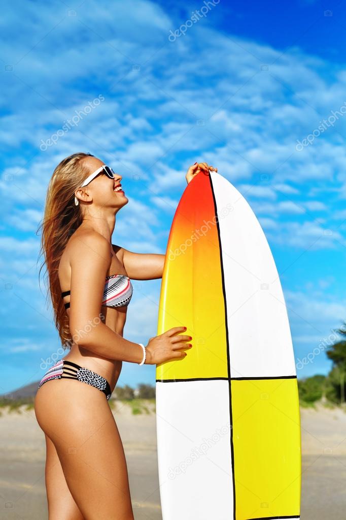 Summer Fun. Leisure Sporting Activity. Surfing. Woman With Surfboard