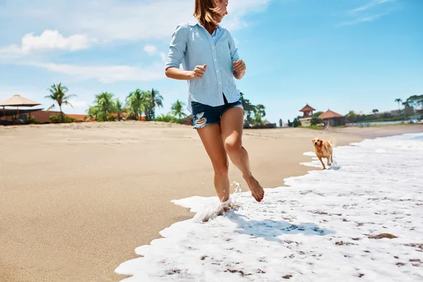 Woman Running With Dog. — Stock Photo, Image