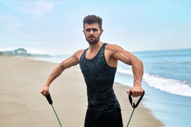 Sports. Portrait Of Man Exercising At Beach During Outdoor Workout