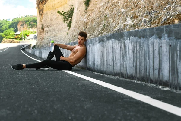 Thirsty Hot Man With Water Resting After Running Workout. Sports — Stok fotoğraf